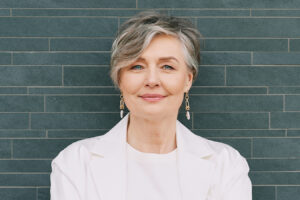 Mature woman representing non-surgical facelift treatments for lifting, smoothing, and facial rejuvenation.