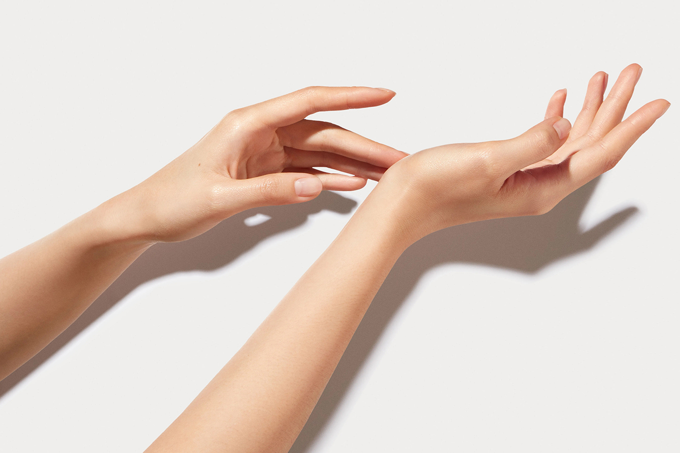 Smooth hands representing treatment for aging hands to reduce wrinkles, veins, and visible tendons.