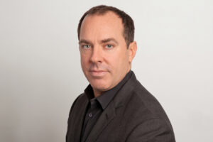 Portrait of a plastic surgeon, representing board certification and trusted surgical care.
