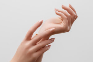 Close-up of hands for aging hands and hand rejuvenation treatment information.