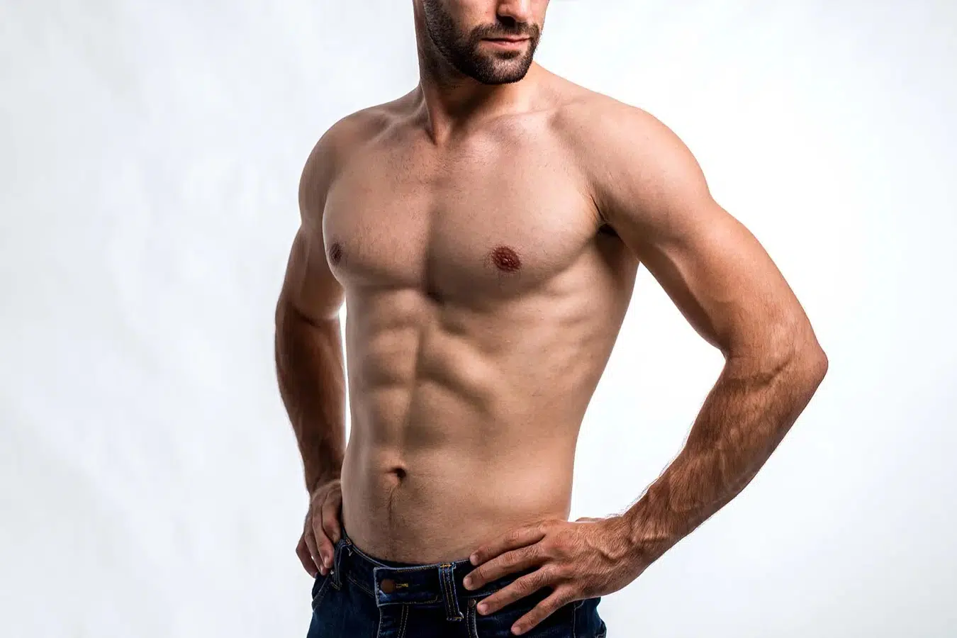Shirtless man representing gynecomastia treatment and male chest contouring in Boston.