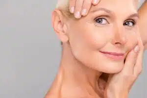 Close-up of a woman with rejuvenated skin, showcasing a healthy and glowing complexion after laser treatment.