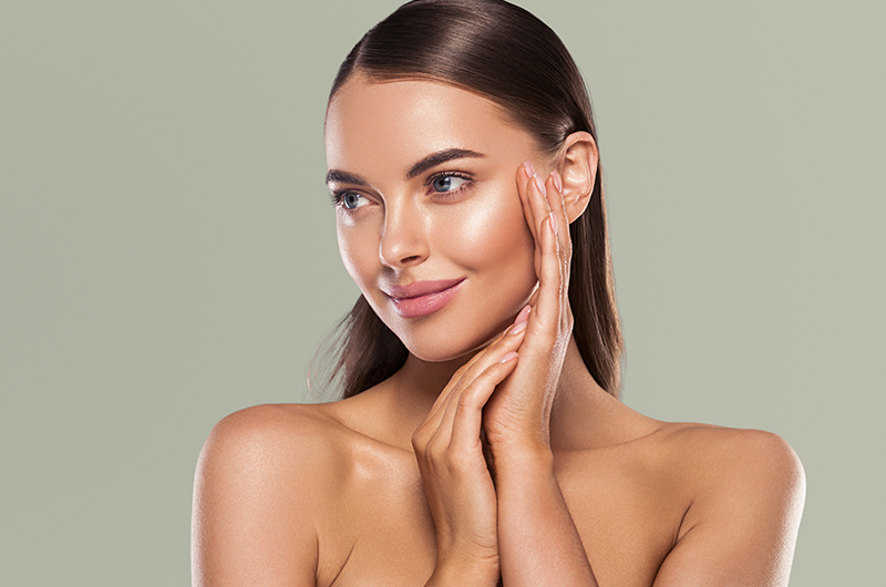 A woman shows off the results of her skincare products recommended by Dr. Sean Doherty, MD in Boston.