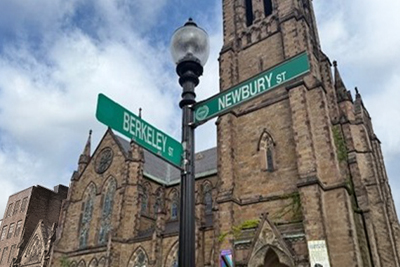 Street signs for Newbury Street and Berkeley Street near Boston office location offering a tranquil patient environment